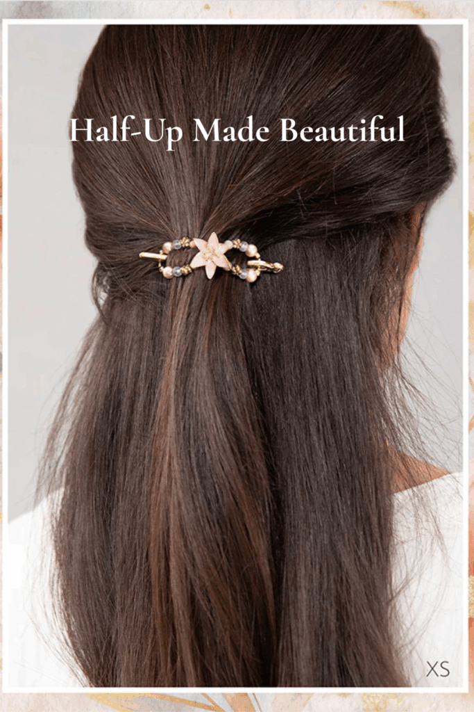 Brunette half-up hairstyle secured with Lilyana Flexi Clip in gold tone, featuring a pink lily flower and pearl accents in XS size.