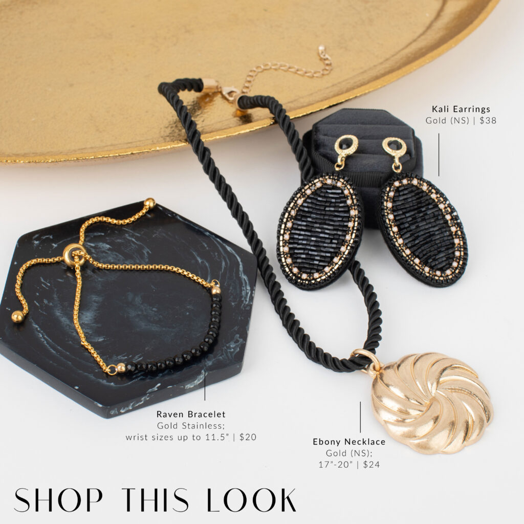 Black-and-gold jewelry flat lay featuring Kali beaded statement earrings, the Raven black jade bracelet, and the Ebony black cord necklace with a sculptural gold pendant. Product names, prices, and the words “Shop This Look” are included on the image.