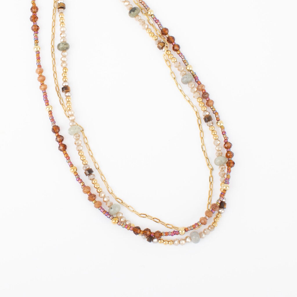 Cedar layered gold necklace with amber, brown, cream, muted green, and iridescent glass beads.