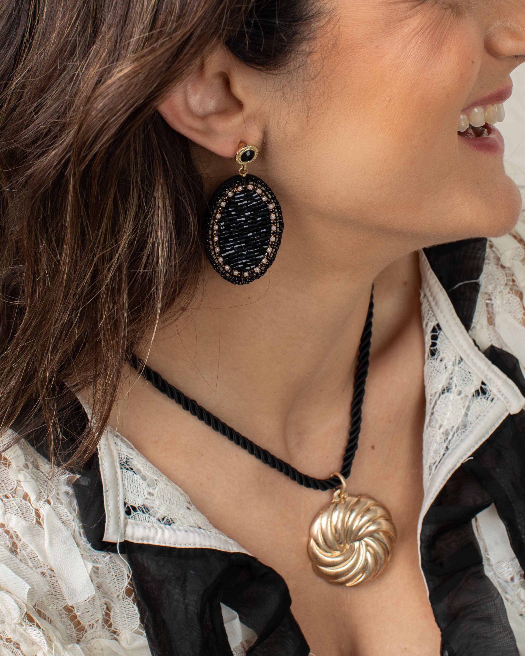 How to Wear Black and Gold Jewelry Without Looking Overdone
