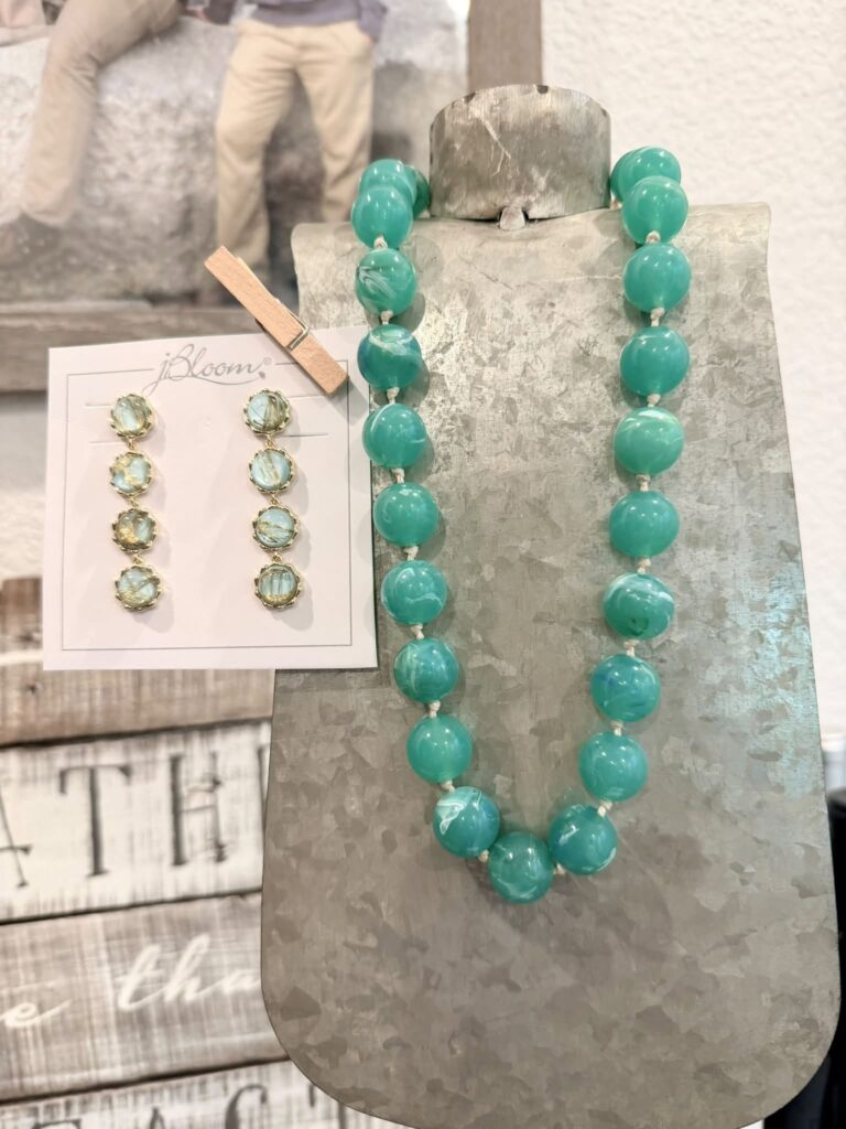 Display of the Briar oversized green resin bead necklace paired with coordinating green drop earrings, highlighting the bold statement bead necklace trend for Fall 2026.