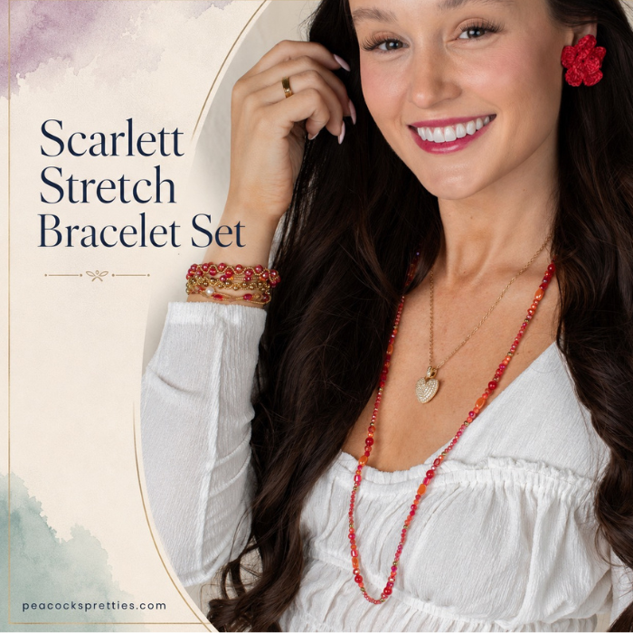 Model wearing the Scarlett Stretch Bracelet Set with rich red, amber, pink and gold beads and a simple white blouse.