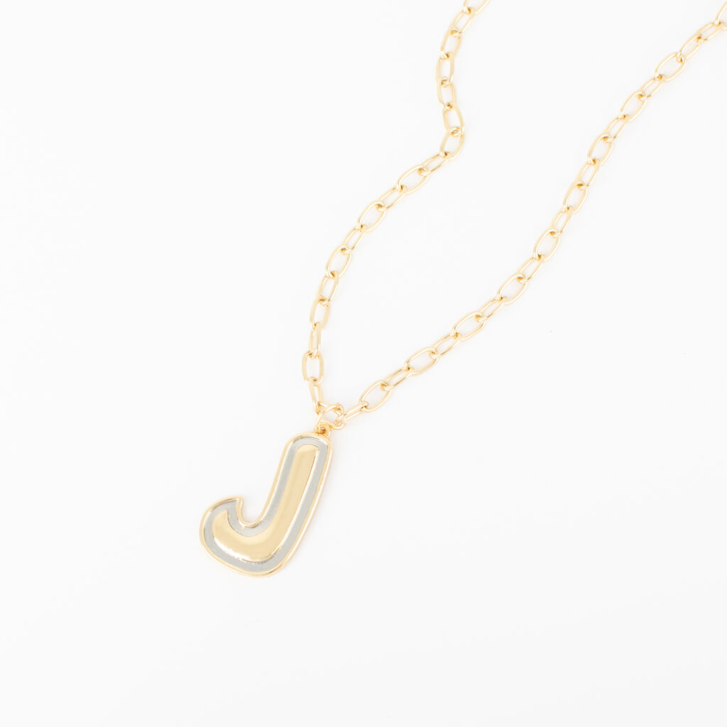 Two-Tone Initial Necklace featuring a gold letter J outlined in silver on a gold paperclip-style chain against a white background.