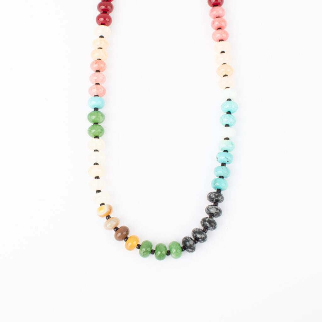 Gertie Necklace featuring multicolored natural stone beads in green, turquoise, pink, cream, brown, red, and black on a white background.