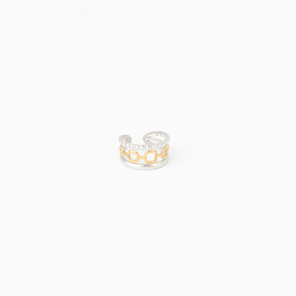 Janae mixed-metal ring featuring a gold link design between textured and polished silver bands on a white background.