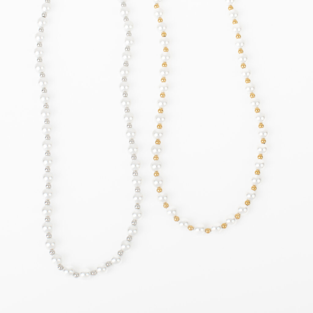 Asher imitation pearl necklaces with gold and silver stainless steel accents.