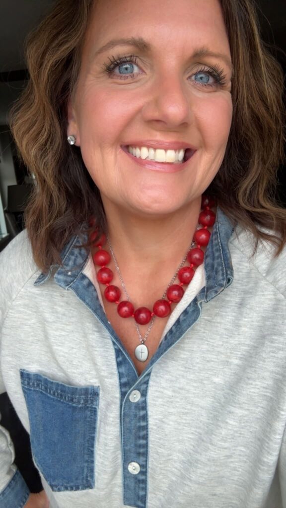 Cherry Bauble Necklace styled with denim and a separate cross necklace