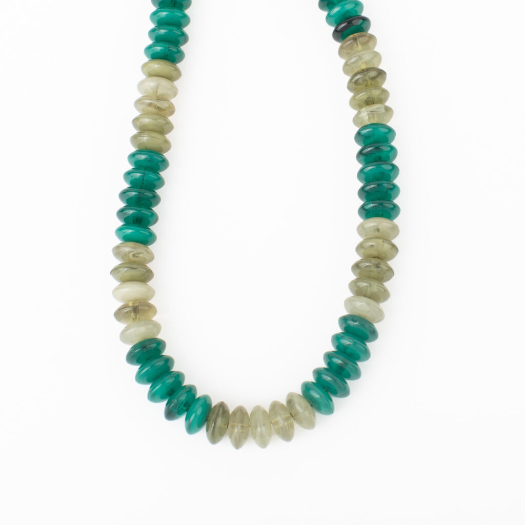 Cypress Necklace with glossy evergreen and translucent smoky neutral acrylic beads on a white background.