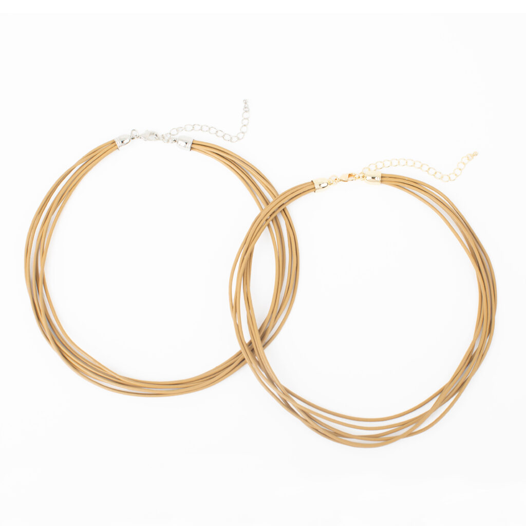 Dawn multi-strand leather necklace in gold and silver finishes with adjustable chain closures.