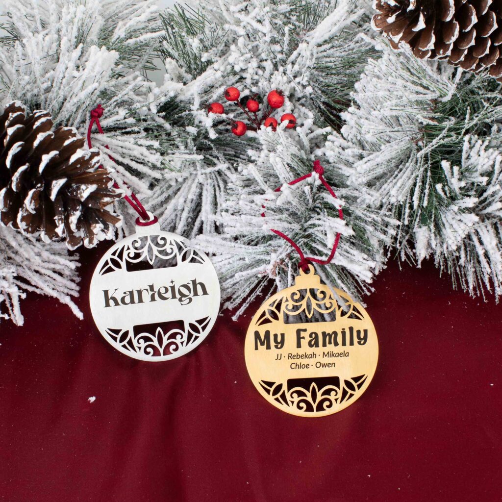 Silver and gold filigree round ornaments personalized with a name and family details