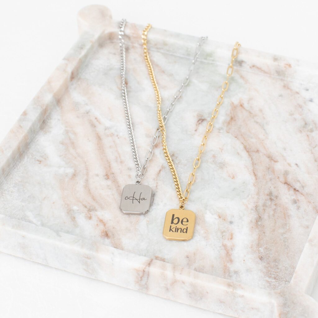 Jani tag necklaces in stainless and gold stainless with example initials and Be Kind personalization