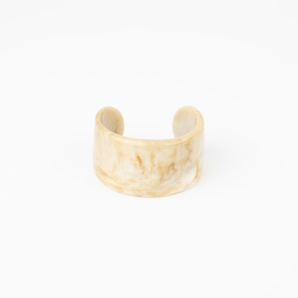 Julep Bracelet with a marbled resin centerpiece and gold details
