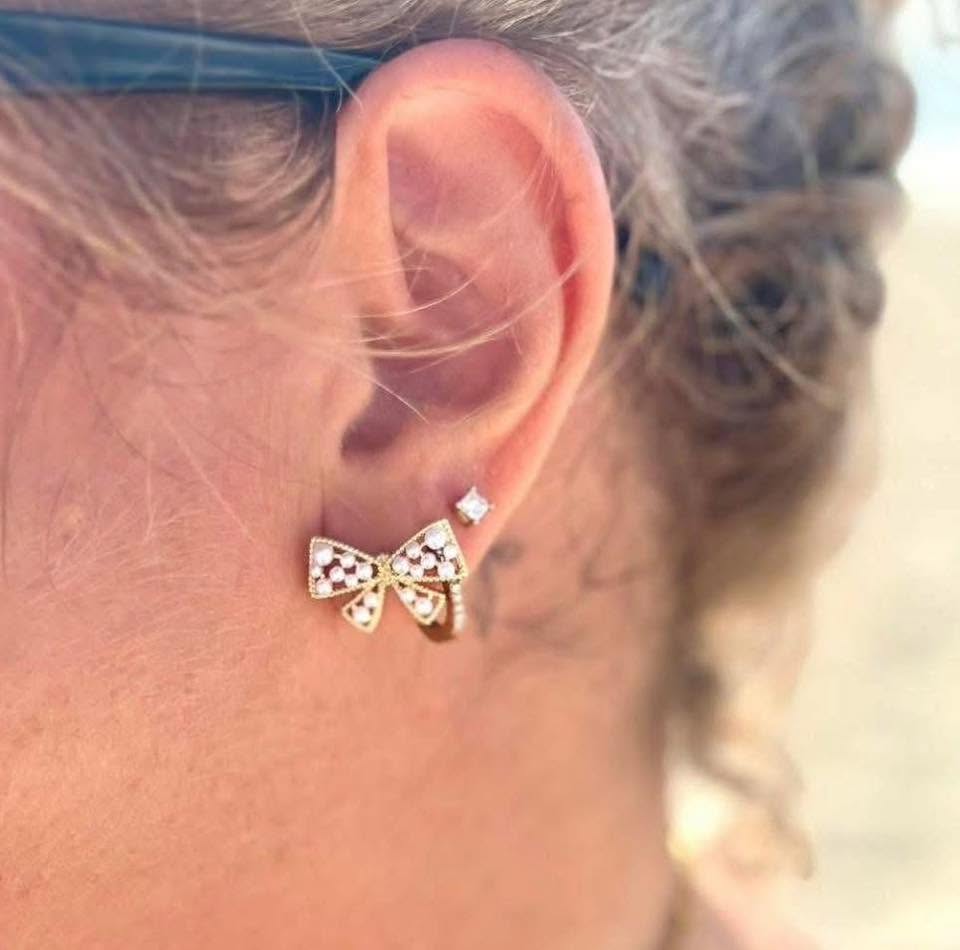 Londyn gold bow stud earrings with pearl accents