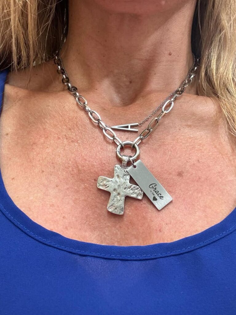 Lora Necklace with a silver Hammered Cross Charm and an additional personalized tag charm