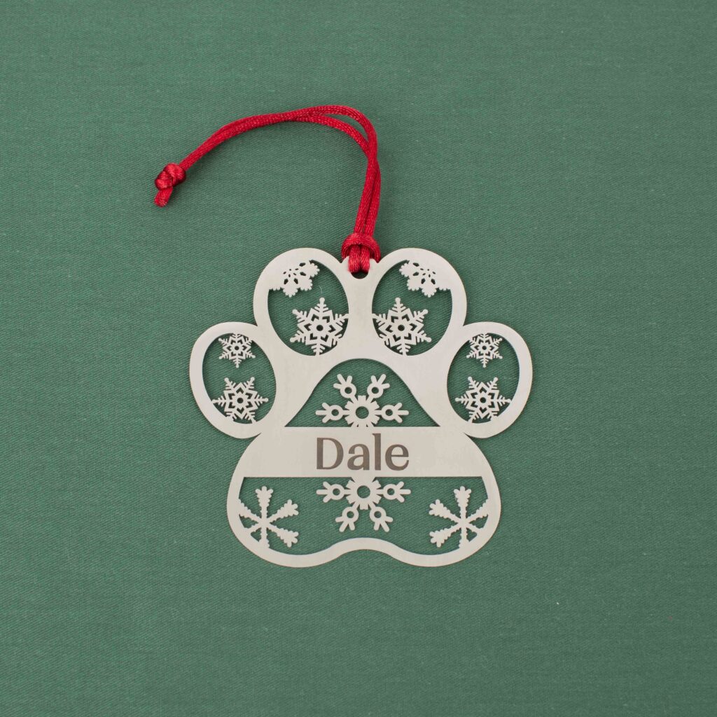 Silver paw print ornament personalized with Dale and snowflake details
